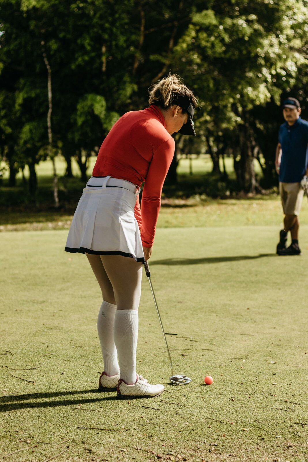 Golfer checking scorecard to calculate handicap