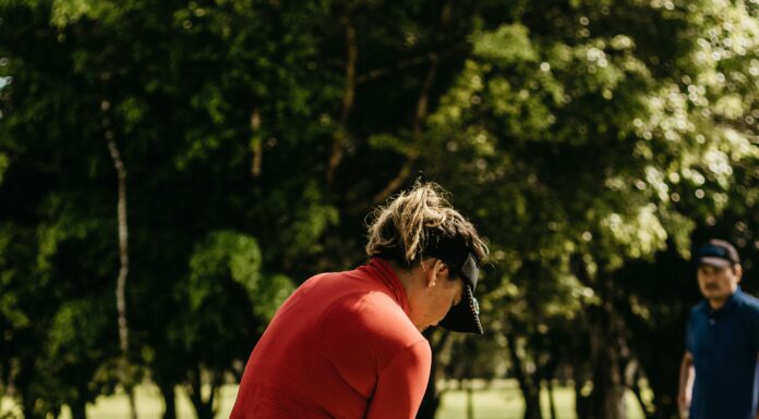 How to Calculate Your Golf Handicap: Simple Guide for Beginners Golfer checking scorecard to calculate handicap